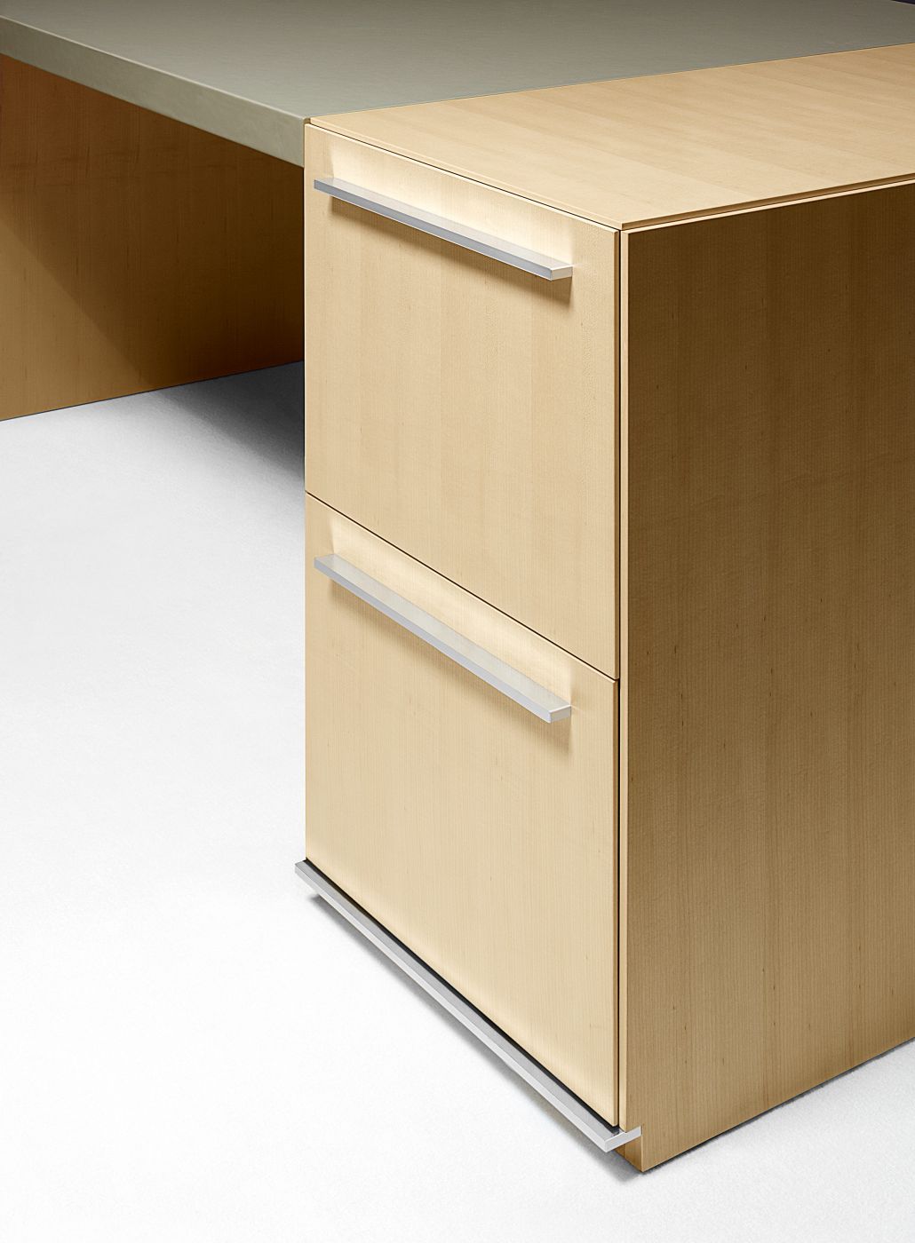 Pedestals and cabinets are available with an optional base accent to complement the Mitre finger pull in proportion and finish.