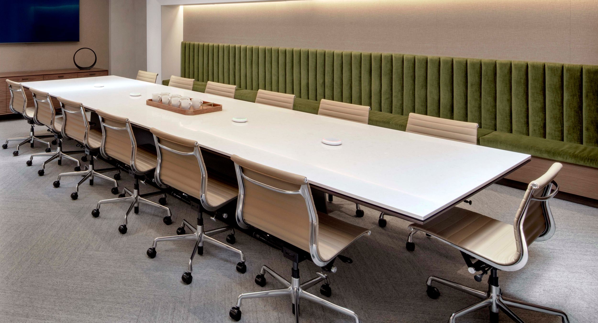 60 x 208 MESA table with bronze metallic matte continuous base. A Cambria Weybourne surface and HALO credenza complete the elevated palette of this elegant space.